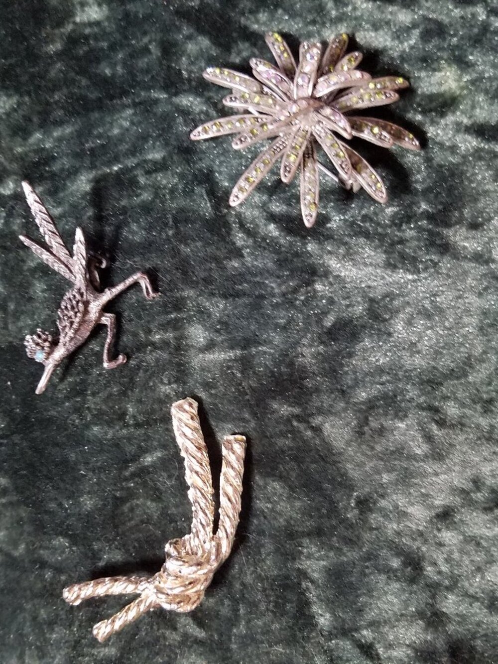 Three Brooches